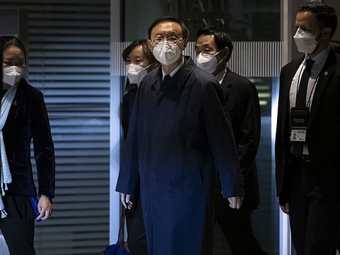 Senior Chinese foreign policy adviser Yang Jiechi, center, and his delegation leave the Hyatt hotel at Zurich Airport, Switzerland, on Wednesday Oct. 6, 2021.  Top diplomatic advisers to U.S. President Joe Biden and Chinese President Xi Jinping have been holding several hours of talks in Switzerland’s largest city in hopes of ironing out differences on a range of topics.