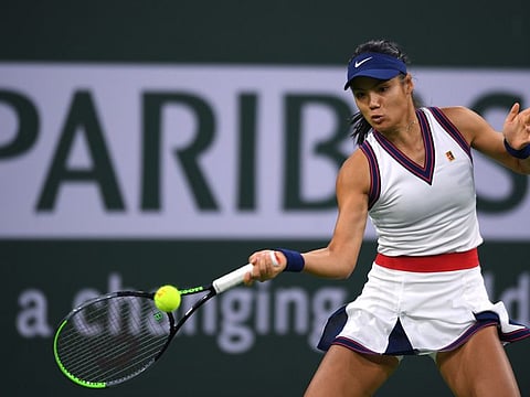 Emma Raducanu hits a shot against Aliaksandra Sasnovich at Indian Wells Tennis Garden. 