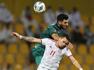 The UAE's Caio Jr battles with Iraq's defender Ahmed Khalaf during the 2022 Qatar World Cup Asian Qualifiers at the Zabeel Stadium in Dubai