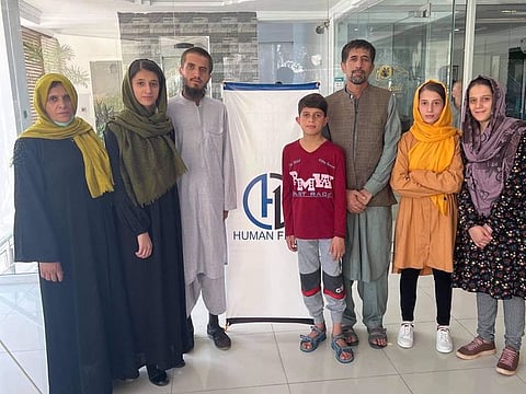 Aman Khalili (third from right) and his family flew on a US government aircraft to Doha, Qatar, where thousands of refugees from Afghanistan are being processed by US officials for immigration, a State Department spokesperson told AFP.