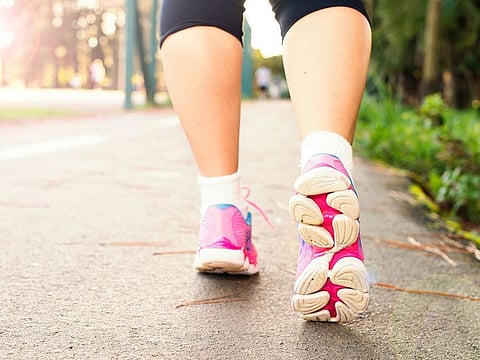 Photo of person walking for illustrative purpose only