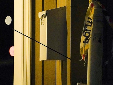 An arrow left in a wall is seen after several people were killed and others were injured by a man using a bow and arrows to carry out attacks, in Kongsberg, Norway, October 13, 2021.