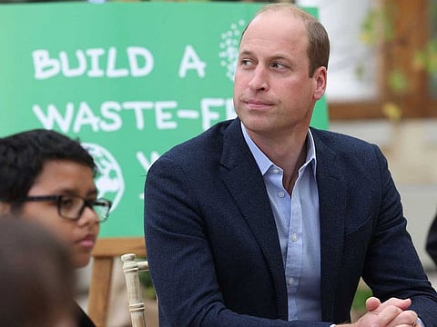 Britain's Prince William, Duke of Cambridge, interacts with children from The Heathlands School, Hounslow during a visit to take part in a Generation Earthshot educational initiative comprising of activities designed to generate ideas to repair the planet and spark enthusiasm for the natural world, at Kew Gardens, London on October 13, 2021.