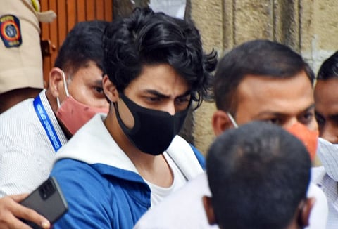 Bollywood actor Shah Rukh Khan's son Aryan Khan leaves the Narcotics Control Bureau (NCB) office to be produced before the court in a drug-related case, in Mumbai on Friday. 