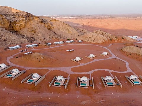 Mysk Moon Resort Sharjah: Flanked by rugged hills on one side, and open to endless reddish sands on the other, the cluster of white domes sits deep in the emirate’s Mleiha region, famed for its natural formations and ancient sites combining to produce an other-worldly horizon.