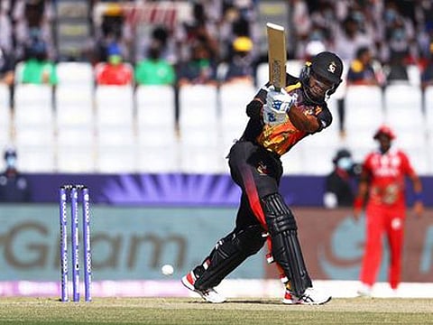 Charles Amini of Papua New Guinea plays a shot to midwicket in the game against Oman in the T20 ICC Men's World Cup at Al Amerat on Sunday. Amini struck 37 runs in 26 deliveries before being run out. 