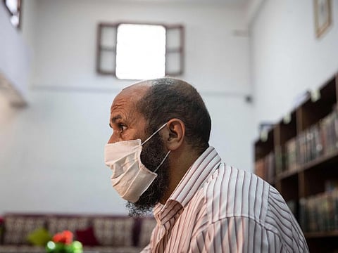 Saleh, a prisoner who has been languishing in Moroccan jails for 19 years on terrorism charges, sits at the library inside the prison of Kenitra, in the coastal city of the same name, near the Moroccan capital Rabat, on August 31, 2021. 