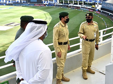 Senior police officials on a last-minute inspection of the Dubai International Stadium.