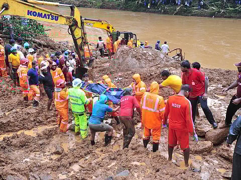 Rescue teams during a search operation at a flood-affected area in Kerala.