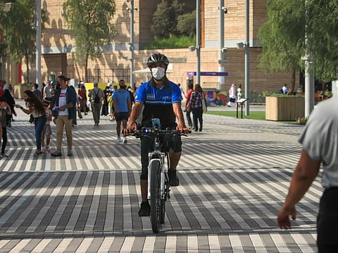 A Dubai policeman on a bicycle at Expo 2020, Dubai. 