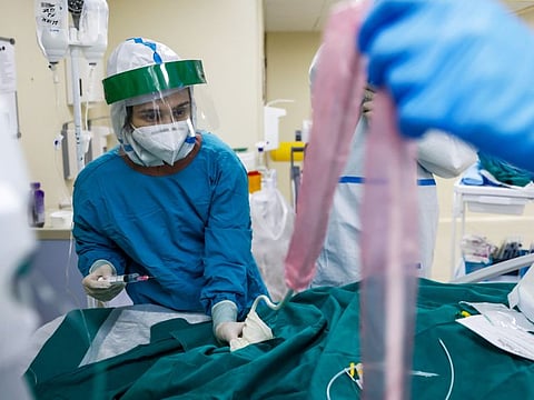 A healthcare worker in the Intensive Care Unit (ICU) of the City Clinical Hospital Number 52, where people suffering from COVID-19 are treated, in Moscow, on October 21, 2021.   “They [healthcare workers] are now burnt out, they are devastated, they are physically and mentally exhausted. And there is a prediction that 10 per cent of them will leave within a very short time.”