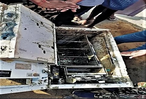 The damaged ATM left behind by the robbers after removing the cash.