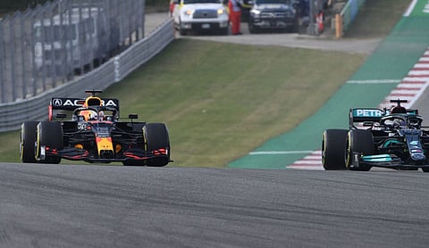 Red Bull's Dutch driver Max Verstappen (left) and Mercedes' British driver Lewis Hamilton race to the first turn during the second practice session at the Circuit of The Americas in Austin, Texas, ahead of the United States Grand Prix. 
