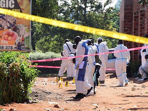 Ugandan explosives experts secure the scene of an explosion in Komamboga, a suburb on the northern outskirts of Kampala, Uganda October 24, 2021. 