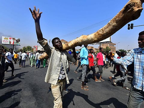 Sudanese people protest against a military coup that overthrew the transition to civilian rule, on October 25, 2021 in the capital Khartoum's twin city of Omdurman.