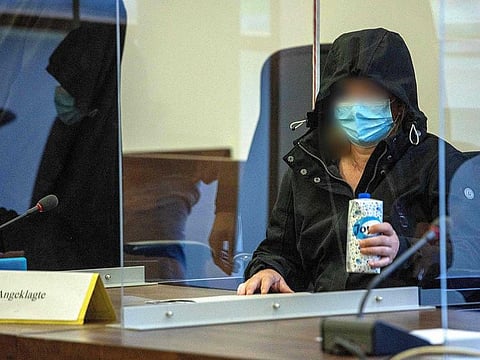 The defendant, a 52-year-old former employee of the Oberlin care centre specialised in helping those with disabilities, waits for the opening of her trial at the district court in Potsdam, eastern Germany, on October 26, 2021. 