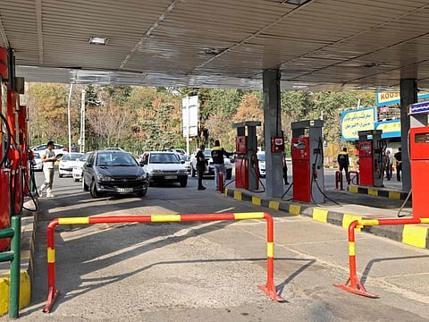 Cars queue to fill up at a service station in Tehran on October 26, 2021, amid a nationwide disruption of the petrol distribution system following a cyber attack. 