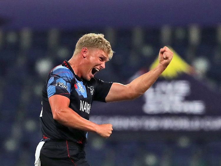Namibia's Ruben Trumpelmann celebrates the dismissal of Scotland's Richie Berrington in the first over