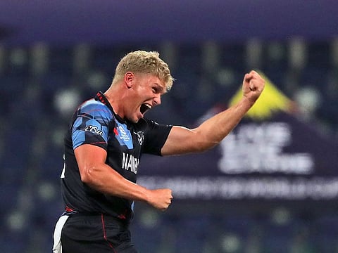 Namibia's Ruben Trumpelmann celebrates the dismissal of Scotland's Richie Berrington in the first over