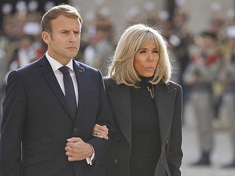 French President Emmanuel Macron and his wife Brigitte Macron take part in a national memorial service for Hubert Germain - the last surviving Liberation companion -  at The Hotel des Invalides in Paris on October 15, 2021, following his death at the age of 101 on October 12. 