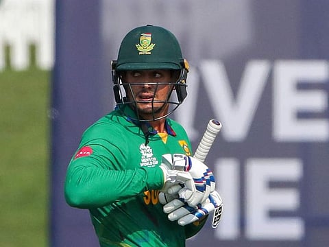 South Africa's Quinton de Kock walks from the field after he was dismissed during the Twenty20 World Cup cricket match against Australia in Abu Dhabi, UAE, on October 23, 2021.