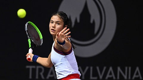 Emma Raducanu, of Britain, returns the ball to Romania's Ana Bogdan at the Transylvania Open WTA tournament in Cluj, Romania.