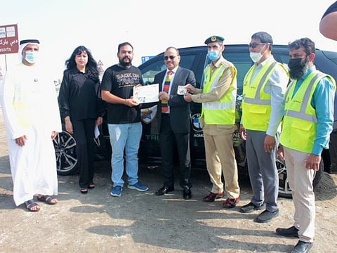Harpal Singh (third from left) receiving the prize from Eugene Mayne, Tristar Group CEO, on Tuesday in Dubai   