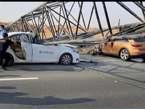 A crane pole fell on two vehicles on Emirates Road in Umm Al Quwain on Tuesday afternoon, severely injuring the vehicles’ drivers.