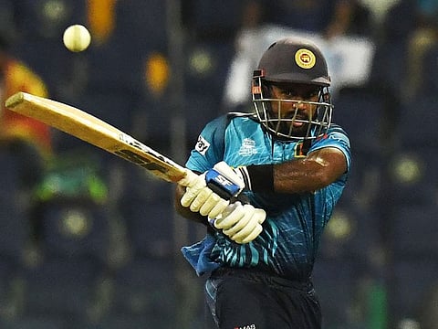 Sri Lanka’s Charith Asalanka plays a shot during the ICC Men’s Twenty20 World Cup cricket match against West Indies at the Zayed Cricket Stadium in Abu Dhabi on November 4, 2021. 