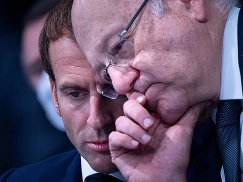 French president Emmanuel Macron (left) speaks to Lebanon's Prime Minister Najib Mikati during a meeting at the COP26 UN Climate Change Conference in Glasgow, Scotland, on November 1, 2021. Mikati also met US Secretary of State Antony Blinken on the sidelines of the UN climate summit.