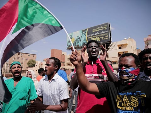 People chant slogans during a protest in Khartoum on October 30, 2021.  
