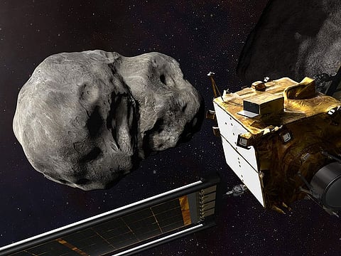 This artist's illustration obtained from NASA on November 4, 2021 shows the DART spacecraft from behind prior to impact at the Didymos binary system.