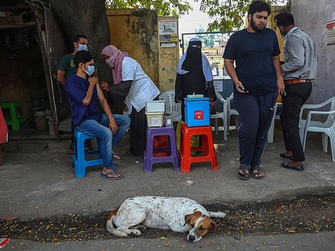 People get inoculated against the COVID-19 at a mobile vaccination drive in Hyderabad, India. People with the gene, known as LZTFL1, would particularly benefit from vaccination, which remains the best method of protection, the authors of Oxford study said.