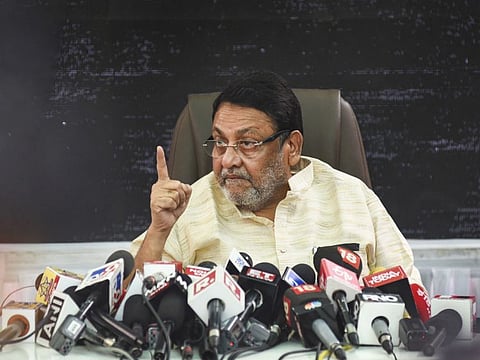 Mumbai: Maharashtra Minister Nawab Malik addresses a press conference at Kurla in Mumbai, Sunday, Nov. 7, 2021.