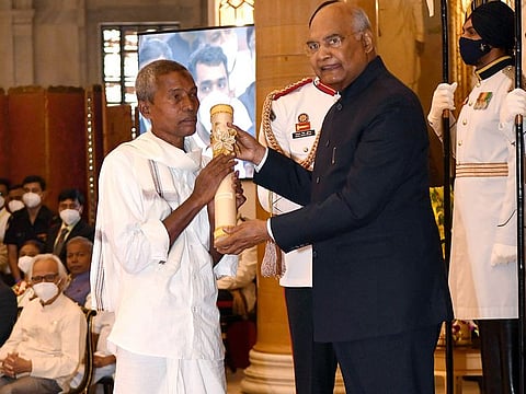 President Ram Nath Kovind presents Padma Shri to Harekala Hajabba, a fruit seller who built a school, for Social Work, in New Delhi on Monday. 