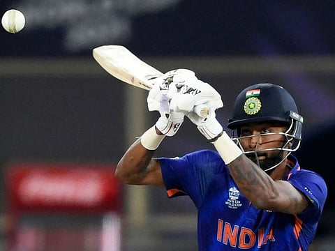 India's Hardik Pandya plays a shot during the ICC Men’s Twenty20 World Cup cricket match against New Zealand at the Dubai International Cricket Stadium on October 31, 2021. 