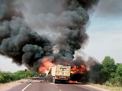 A fire breaks out after a collision between a passenger bus and a truck near Pachpadra, in Barmer on Wednesday.  
