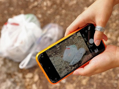 Elishya Ben Meir, an 18-year-old Israeli, uses the "Clean Coin" mobile application to find and safely dispose of abandoned waste.