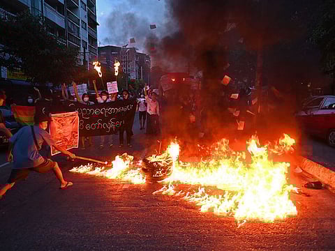 In this file image protesters are seen burning posters during a demonstration against the junta in Myanmar 