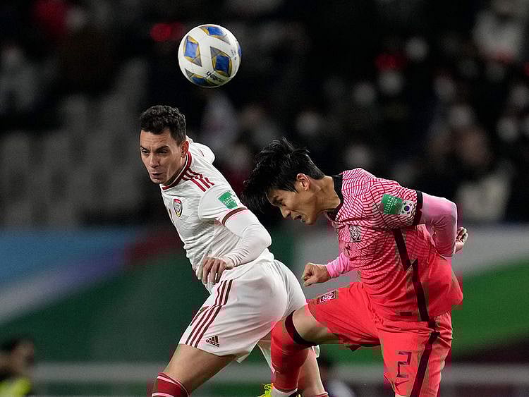 UAE's Caio fights for the ball South Korea's Lee Yong during their World Cup qualifier