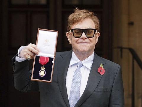 Sir Elton John after being made a member of the Order of the Companions of Honour for services to Music and to Charity during an investiture ceremony at Windsor Castle, in Windsor, England, Wednesday, Nov. 10, 2021.