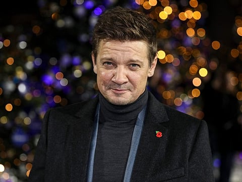 Jeremy Renner poses for photographers upon arrival at the UK Fan Screening of the film 'Hawkeye' in London on Thursday, Nov. 11, 2021.