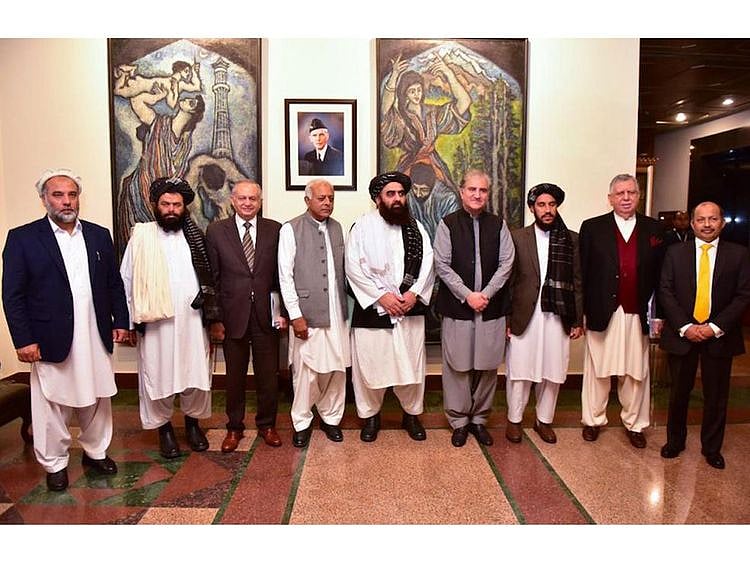 Shah Mahmood with acting Afghan foreign minister Amir Khan Muttaqi in Islamabad