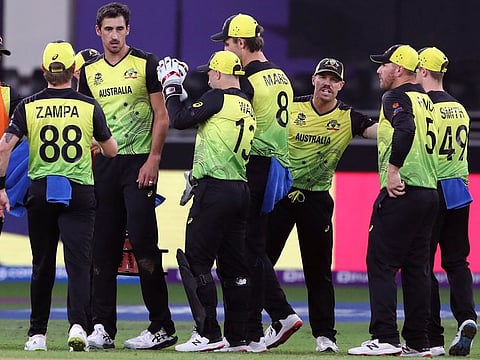 Australia's Mitchell Starc celebrates the dismissal of Pakistan's Mohammad Rizwan during the semifinal of the ICC Men's T20 World Cup  at Dubai International Stadium on November 11, 2021.