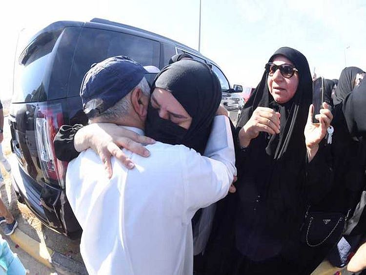 Relatives welcome pardoned inmates after their release. 