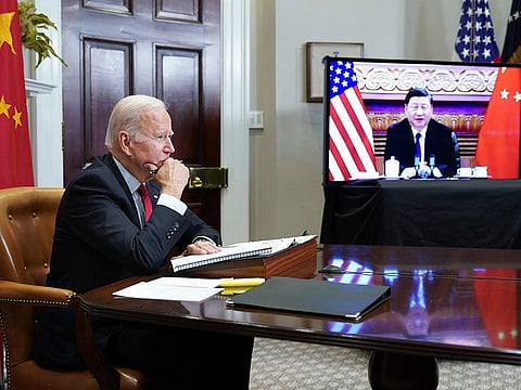 US President Joe Biden meets with China's President Xi Jinping during a virtual summit from the Roosevelt Room of the White House in Washington.  