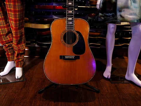A Martin D-45 acoustic guitar, previously owned and played on stage by Eric Clapton, sits on display at Julien’s Auctions and Public Exhibition media preview at the Hard Rock Cafe at Times Square in New York City, U.S., November 15, 2021.