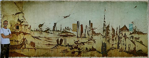 Akbar Saheb with his oil-on-canvas which measures 18 feet X 7 feet and is entitled Past, Present and Future.
