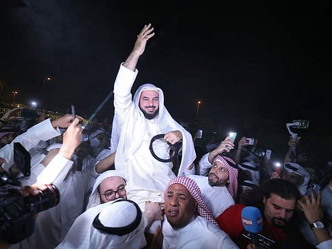 Former Kuwaiti MP Jamaan Al Herbesh is carried by supporters upon his arrival back in Kuwait City on November 15, 2021, following the pardon decree by the Emir of Kuwait. 