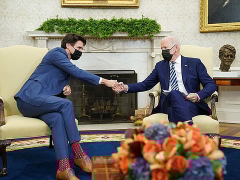US President Joe Biden and Canada's Prime Minister Justin Trudeau take part in a bilateral meeting in the Oval Office of the White House in Washington, DC on November 18, 2021. 